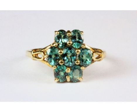 A 9ct gold and green diopside cluster ring, (N.5).