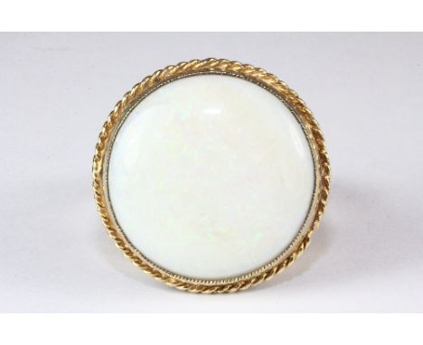 A 9ct gold and large opal ring (d. 1.8cm), (U).