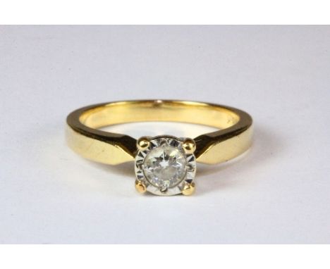 An 18ct yellow gold diamond solitaire ring, (M.5).