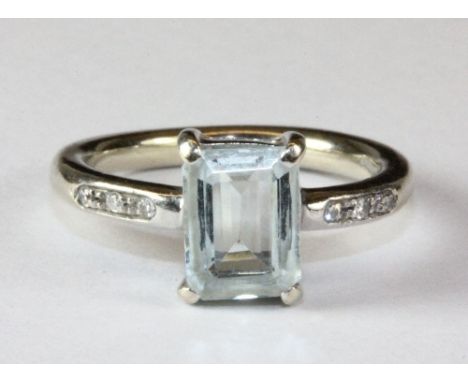 A platinum aquamarine and diamond ring (J.5).