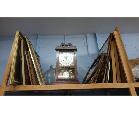 Quantity of prints and a mantle clock