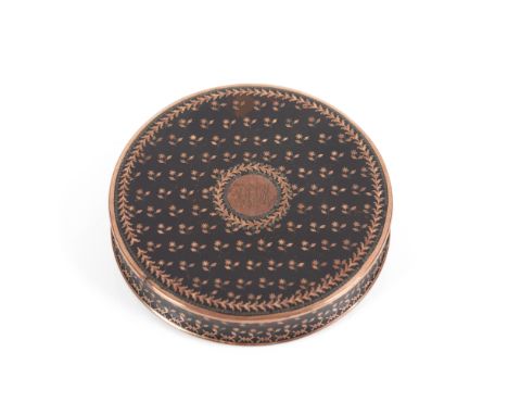 A round box and cover Turtle shell of incrusted gold decoration with flowers and foliage garlandsCentral monogrammed medallio