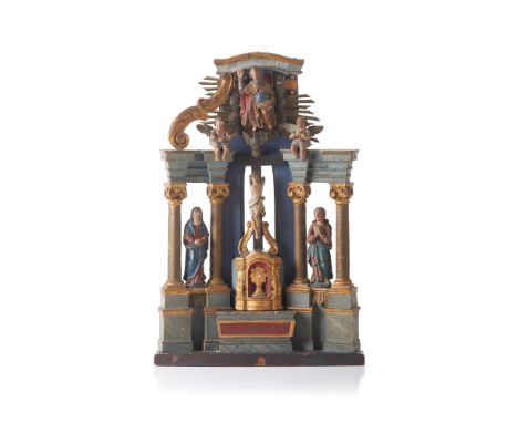 A small sized altar Carved, gilt and polychrome wood depicting the Holy TrinityIn the centre The Crucified Christ flanked by 