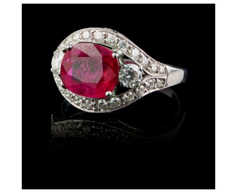 A Ruby Ring Gold 750/000 set with a ruby, possibly Burmese, weighing approximately 3,60 ct, and twenty-eight brilliant-cut di