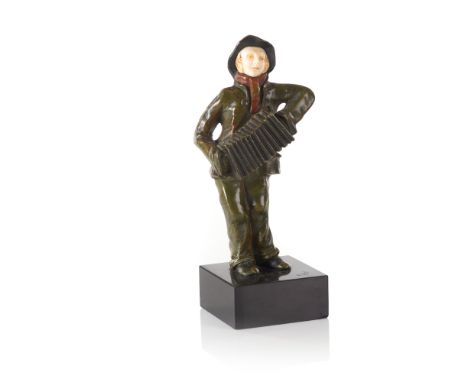 Alfred Jorel (1860-1927) A boy playing the accordionA patinated bronze sculpture with an ivory faceMarble stone baseSigned at