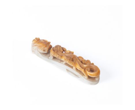 A buckle Carved white and brown jade  depicting a Chilong (mythical Chinese dragon)China, possibly Ming dynasty or later   Ac