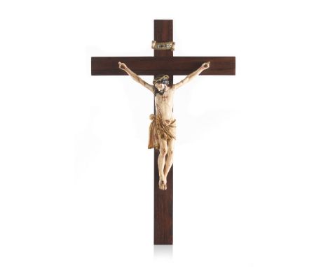 A crucified Christ Indo-Portuguese ivory sculpture of part painted and gilt decorationRosewood cross with ivory label inscrib