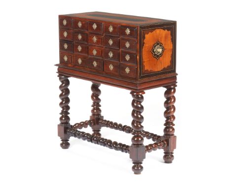 An Indo-Portuguese cabinet In teak and sissoo with ivory inlaysFront with fifteen drawers simulating eighteenYellow metal cut