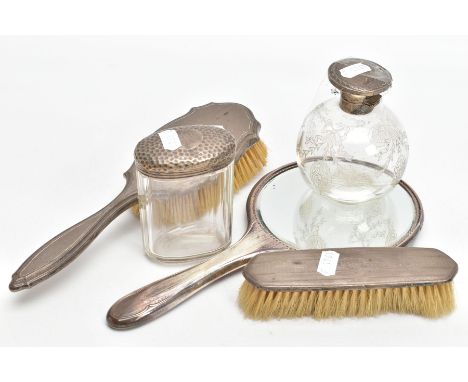 FIVE DRESSING TABLE ITEMS, to include a round glass scent bottle with an etched bow and foliate design, fitted with a silver 