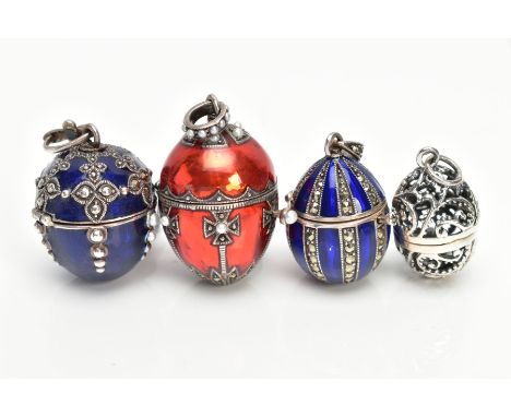 FOUR WHITE METAL AND ENAMEL EGG PENDANTS, to include a white metal openwork egg fitted with a suspension loop (unmarked), a w
