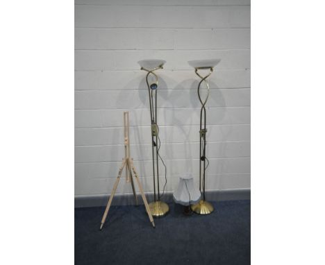 TWO MODERN BRASS STANDARD LAMPS, one with a work light, a table lamp and an artist's easel (4)