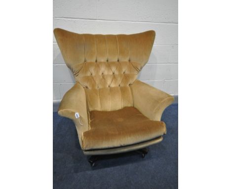 A G PLAN MODEL 6250 GOLD UPHOLSTERED WING BACK ARMCHAIR, on rosewood effect legs, on casters (this chair does not comply with