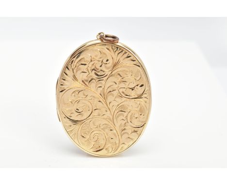 A 9CT GOLD LOCKET, an oval locket embossed with a foliate and scroll design, engraved on the rear with' J R H', photos enclos