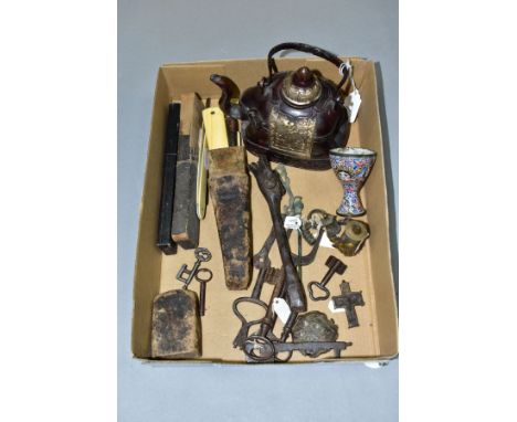 A BOX OF ARTEFACTS, KEYS, CASED CUT THROAT RAZORS, ETC, to include an enamelled egg cup with Indian/Persian style decoration,