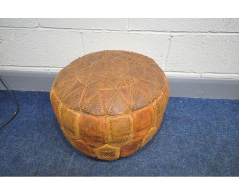 A VINTAGE LEATHER PATCHWORK POUFFE with etched panels, diameter 49cm (condition:- in good condition but lightly worn conditio