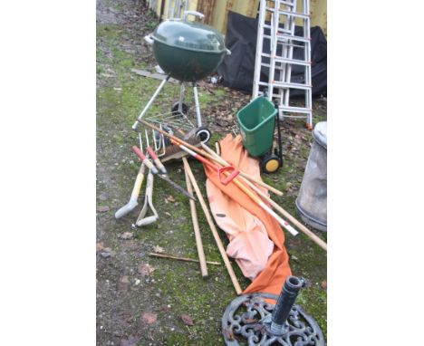 A WEBER BARBECUE, a parasol  and stand along with various garden tools