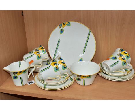 A TWENTY ONE PIECE ART DECO PALISSY TEASET with geometric floral printed pattern and angular handles, comprising a cake plate