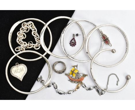 AN ASSORTMENT OF COSTUME JEWELLERY, to include a stainless steel torque bangle, detailed with engraved lines, also including 