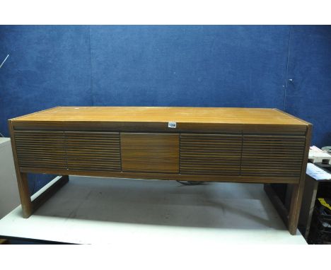 A HMV TYPE 2353 RADIOGRAM in a mid-century cabinet with original warranty card from 1973 (PAT fail due to uninsulated plug bu