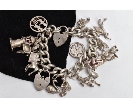 A SILVER CHARM BRACELET, a curb link bracelet each link stamped sterling, fitted with a heart shaped padlock stamped 'Silver'
