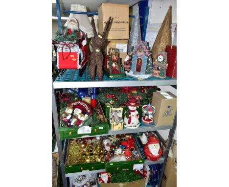A QUANTITY OF CHRISTMAS DECORATIONS, including artificial garlands, battery operated musical light up models, a model sleigh 