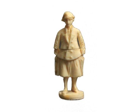 A 19th Century carved Dieppe ivory standing needle case, as a male fisherman in traditional costume, one hand to his pocket, 