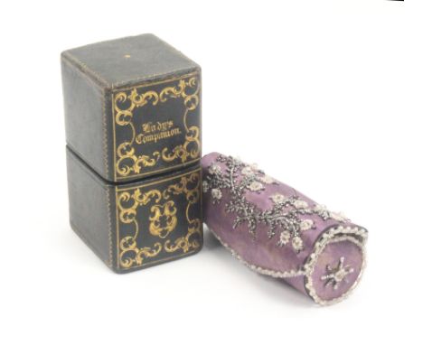 A lady's companion and a reel roll, the first in green leather with titled tooled spine the interior with tool card, thimble,