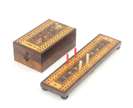A Tunbridge ware rosewood card box and a cribbage board, the fist of hinged rectangular form with floral mosaic within a crib