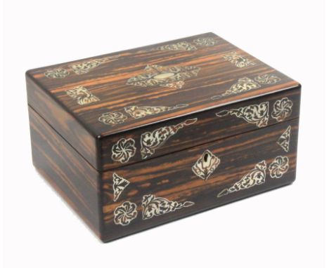 A mid Victorian coromandel wood rectangular sewing box the front and lid inlaid with panels of cut mother of pearl, the lid i