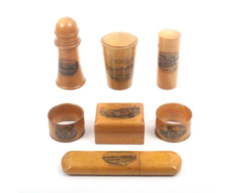 Mauchline ware - seven pieces comprising a spectacle case (Esplanade, Bognor) 15.5cm, a cylinder light house box (Walmer Cast