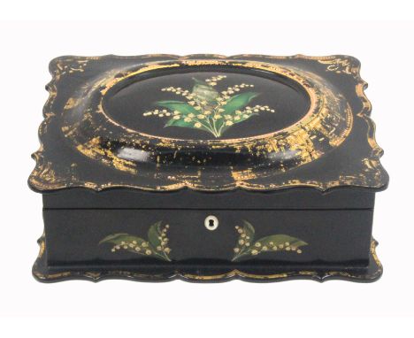 A mid Victorian papier Mache sewing box of rectangular form the black ground decorated in gilt, the base and lid with shaped 