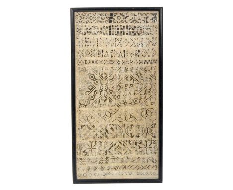 An 18th Century whitework band sampler  worked in variable sized bands with panels of cutwork in a glazed frame, 41 x 20cm