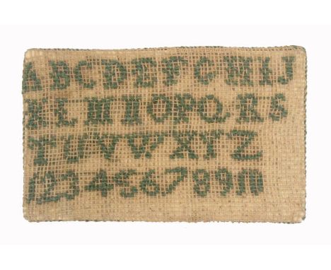 A miniature sampler style pin card, of rectangular form one side worked with alphabet and numerals, the reverse in green silk