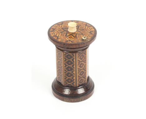 A Tunbridge ware rosewood go-to-bed, the octagonal body in panels of geometric mosaic, the turned rosewood base with striking