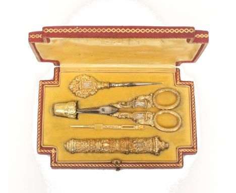 A fine French etui with parcel-gilt silver tools, in red leather- covered case with incut corners, the cover gilt- tooled wit