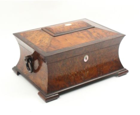 A mid Victorian burr yew wood sewing box of sarcophagal form, mother of pearl escutcheon and lid oval, wooden ring side handl