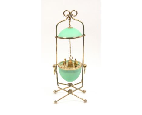  A mid 19th Century green glass and gilt metal mounted sewing companion in the form of an egg, the cover raised by a chain on