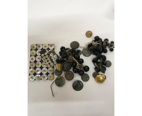 A comprehensive collection of buttons, buckles and similar items comprising four ring binders of cards of buttons, including 