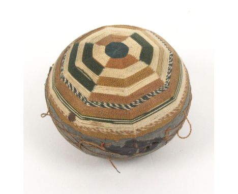 A late 18th Century pin ball, in shades of green, light brown and cream in bands of variant colours as a radiating octagon, s
