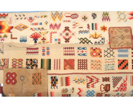 A group of unmounted spot samplers, comprising a roll of numerous panels of coloured geometric wool work, 22 x 160cm, another
