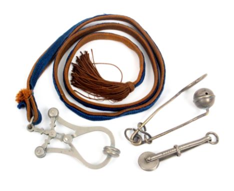 Three skirt lifters, comprising a white metal 'Bijou' on blue and brown cord suspension with tassel, clip 9.5cm, a small whit
