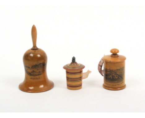 Three tape measures comprising a ring painting early Tunbridge ware example, complete but fragile inked tape, 3cm, a bell sha