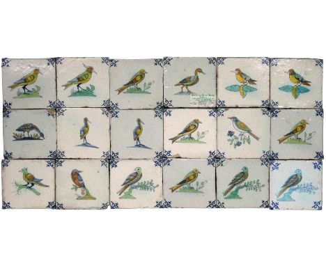 A set of thirty Dutch polychrome Delft tiles each depicting a bird on branch or grass in tones of blue, yellow, green and bro