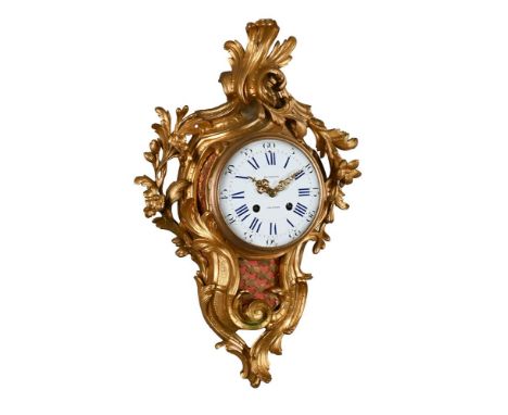 A FRENCH LOUIS XV STYLE GILT BRASS CARTEL CLOCKRETAILED BY BENNETT, LONDON, THIRD QUARTER OF THE 19th CENTURYThe circular eig