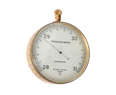 A GILT BRASS ANEROID FORECASTING BAROMETER NEGRETTI AND ZAMBRA, LONDON, EARLY 20th CENTURY The barometer with 3.5 inch circul