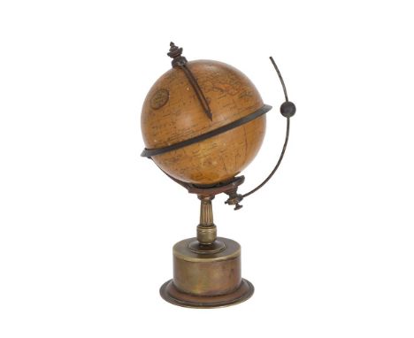 AN EDWARDIAN 'EMPIRE' TERRESTRIAL GLOBE TIMEPIECEUNSIGNED, CIRCA 1906The 5.5 inch sphere applied with twelve coloured printed