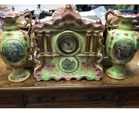 A Victorian ceramic clock set decorated with figures in country side views.