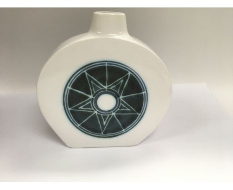 A Troika vase with white glaze and geometric pattern to the centre.17 cm .