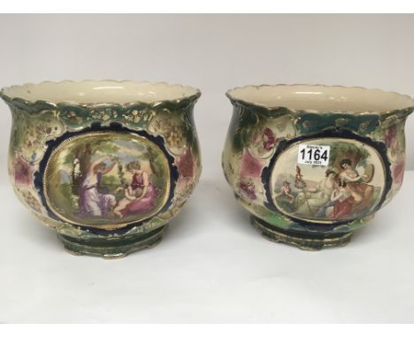 A pair of late Victorian ceramic jardiniere decorated with classical figures. Height 23cm diameter 28cm. NO RESERVE