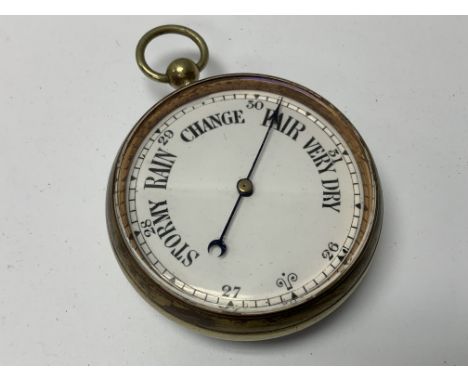 A vintage pocket barometer (B)